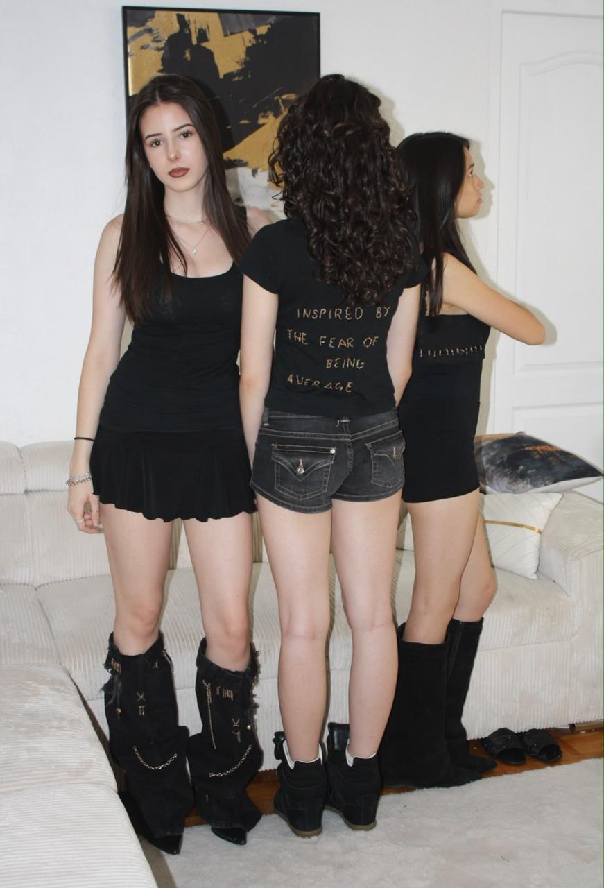 Friends styled in Chez Rafu pieces, posing in a living room